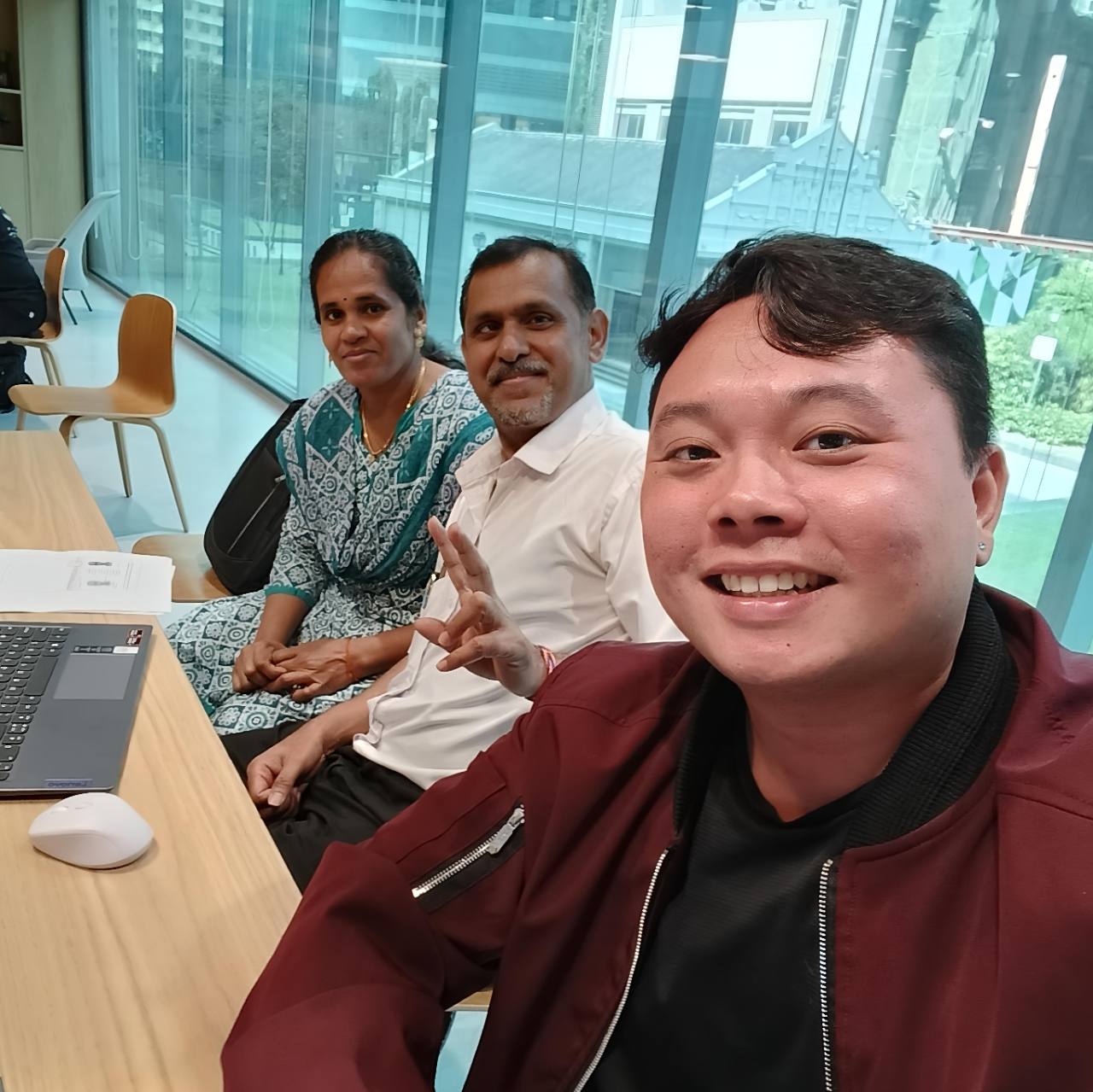 Alvin with the Citizenship client couple shown in the featured WhatsApp conversation.