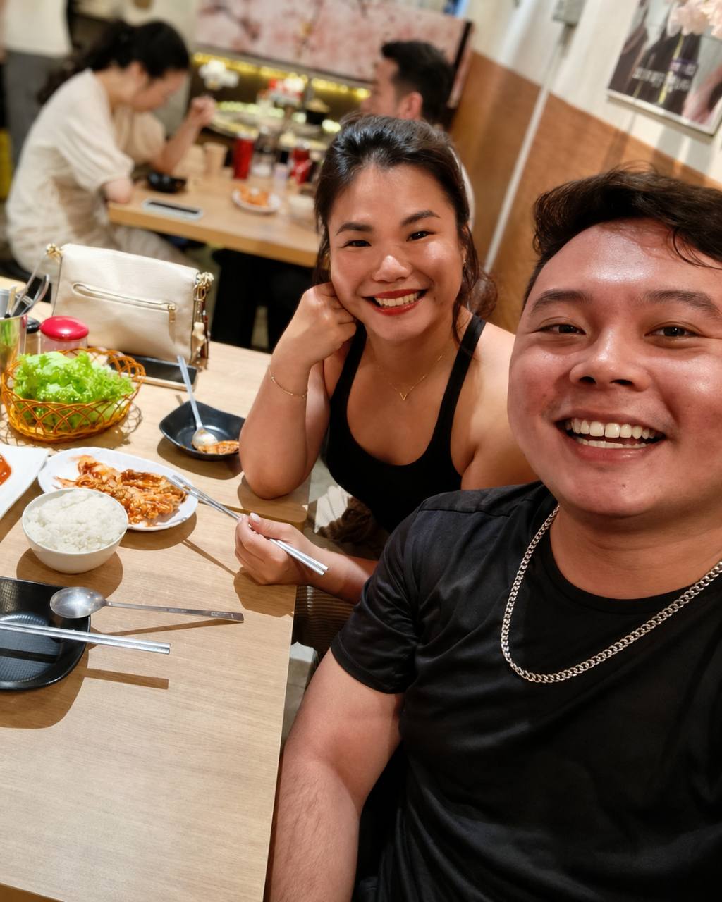 Alvin smiling together with a client.