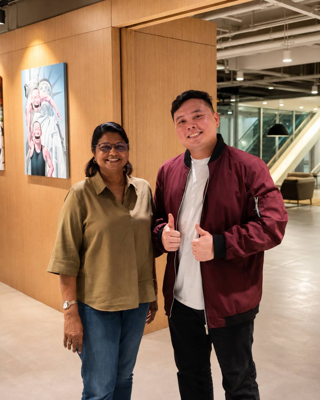 Alvin standing with a client at One Raffles Place.