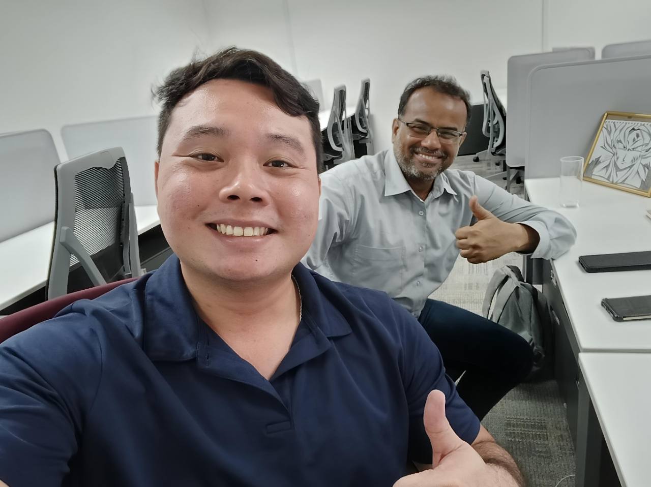 Alvin smiling with the PR client who shared feedback about his professional support.